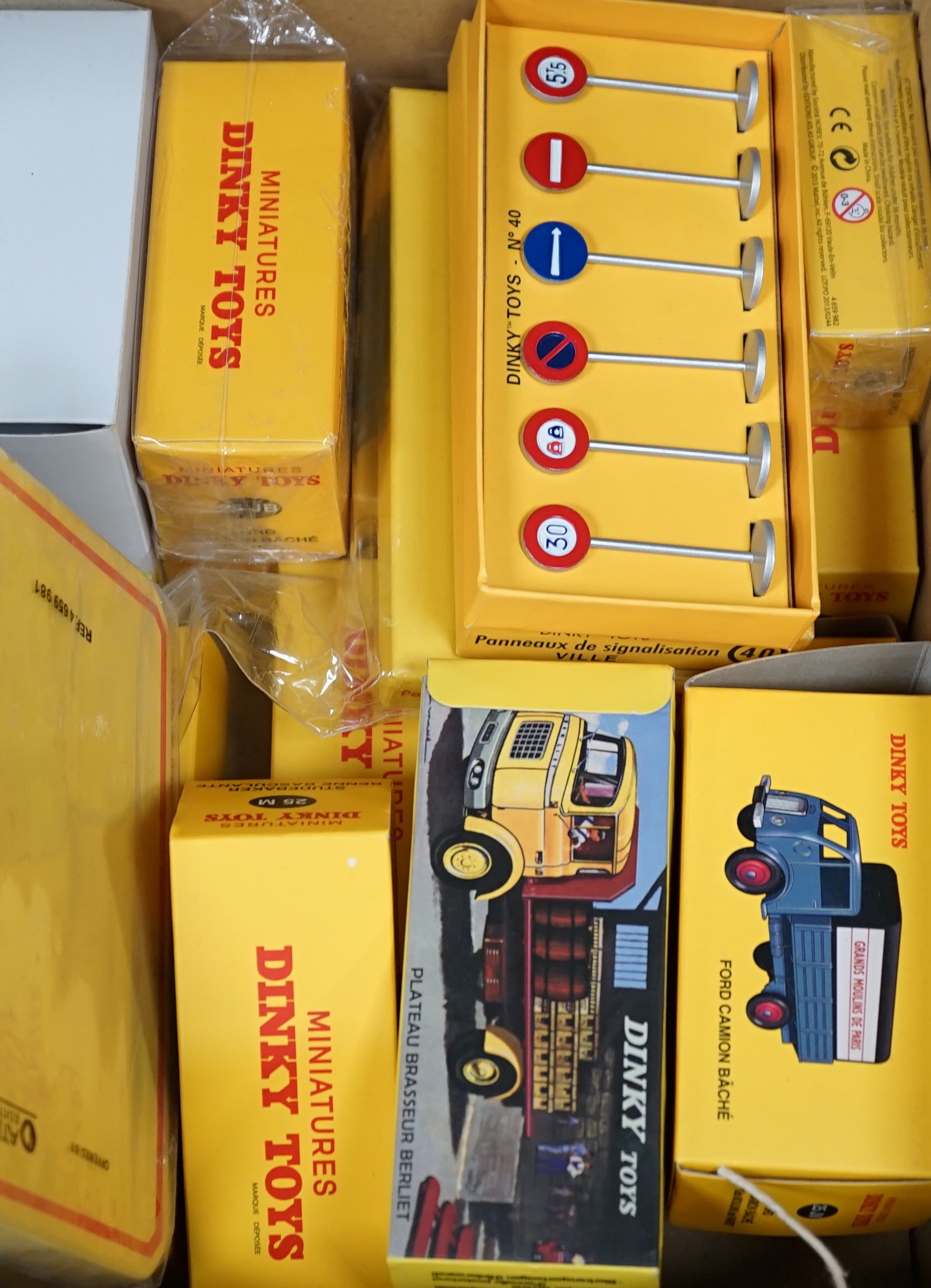 A large quantity of Norev (reproduction) boxed dinky lorries, vans, road sins, petrol pump, etc